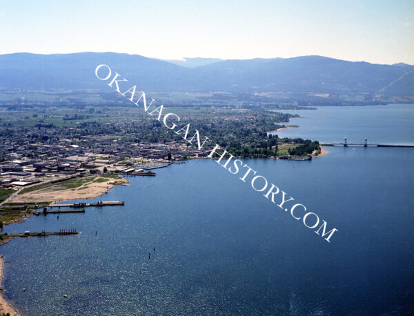 Aerial view of Kelowna bridge BC waterfront and bridge, 1965, photographed by Allan Ribelin