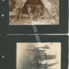 Two 1910 photographs on a black album page: two men in hats beside a canvas wall tent in a wooded camp, pencil-captioned on the mount, and a group of people gathered among felled timber in a cleared area
